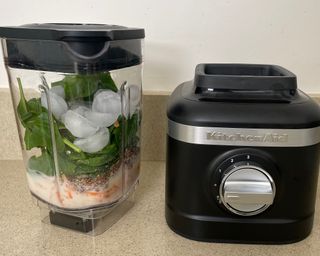 Green smoothie before blending in the KitchenAid K150 blender