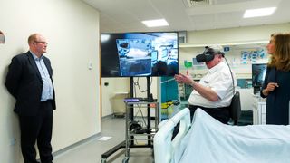 A photo of an operating theatre and a doctor using a virtual reality headset