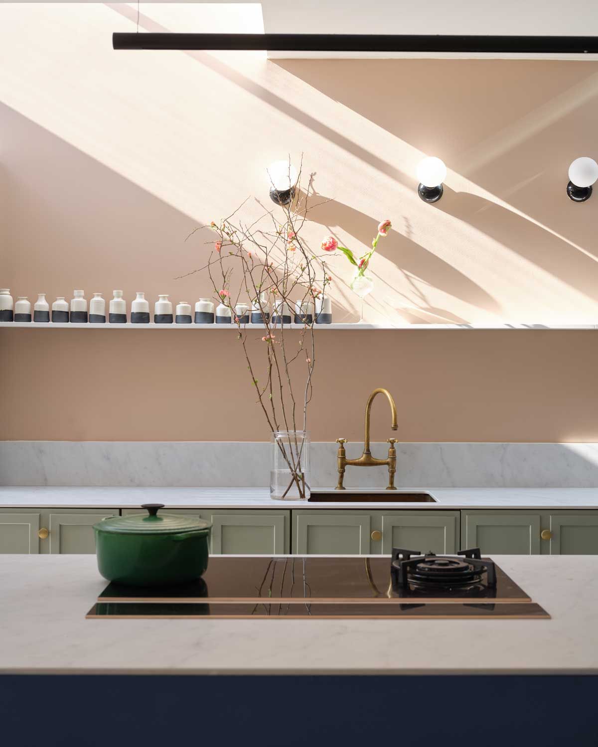 pink paint color on a kitchen wall in the sunshine