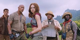 Jumanji: Welcome to the Jungle Dwayne Johnson and cast looking at distant danger