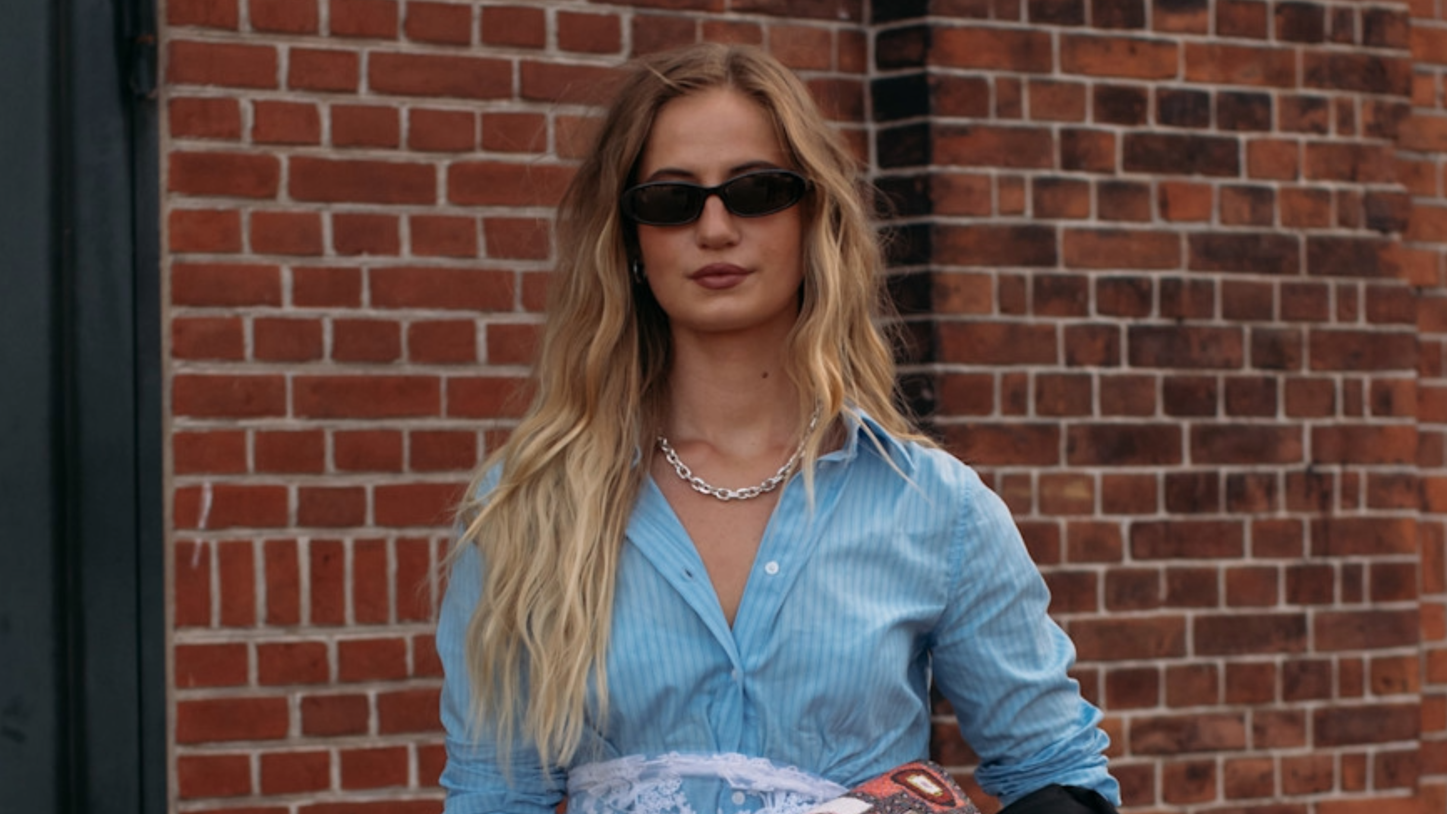 woman wearing a blue button-down shirt in Copenahgen 
