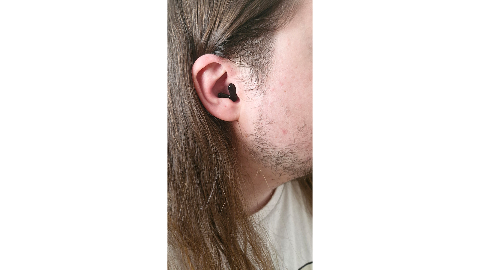 Alpine Tune earplugs in a man's ear