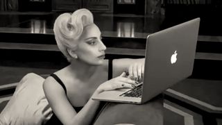 Lady Gaga using MacBook