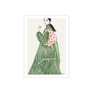 A wall artwork of a woman in a green dress