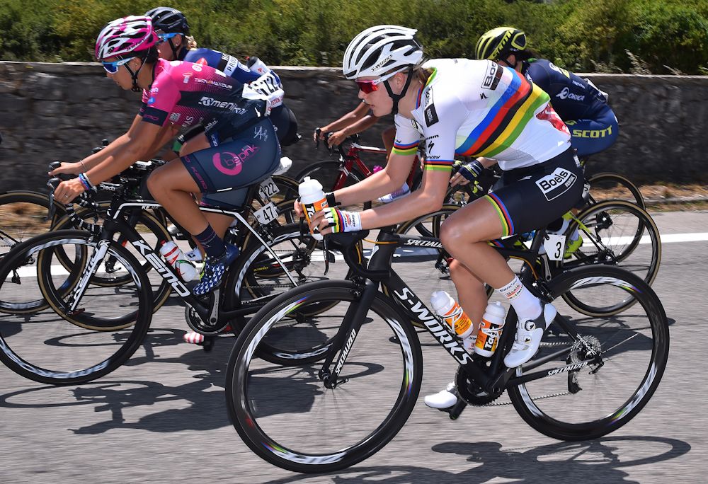 World champion Amalie Diederiksen takes bottles to her teammates.