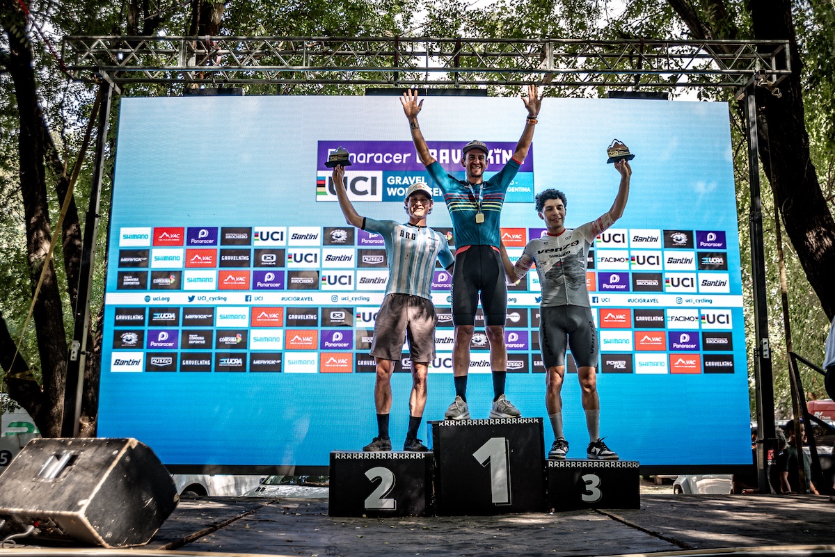 The elite men's podium at the 2026 Gravel Argentina. Joaquin Plomer in first, Lance Haidet in second and Franco Orocito in third