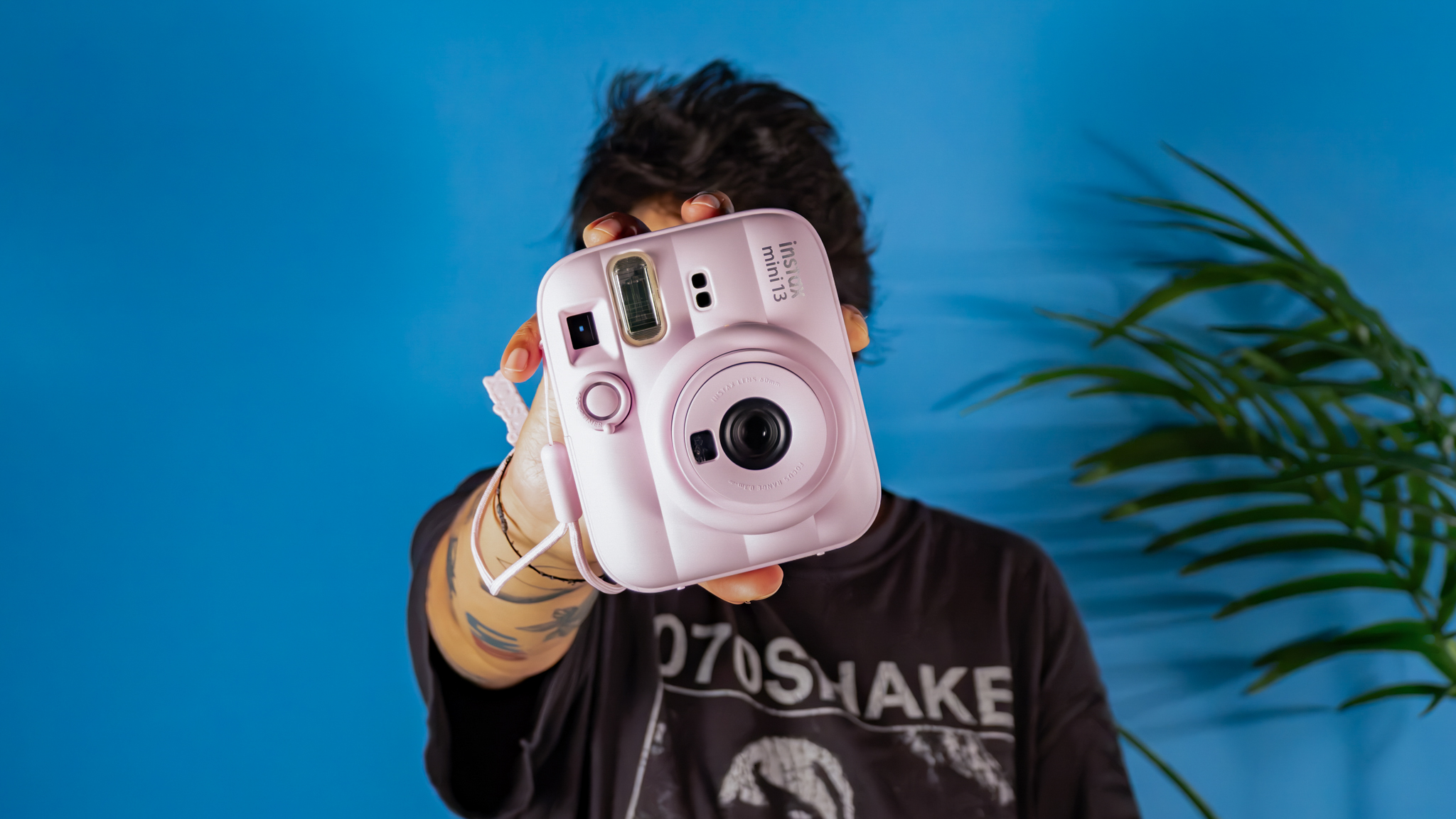 A Candy Pink Fujifilm Instax mini 13 instant camera