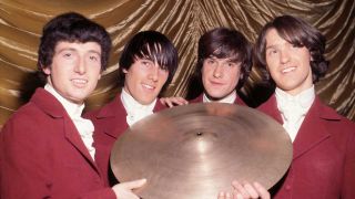 The Kinks holding a cymbal, 1964