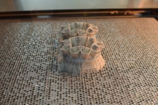 A photo of a 3D printed Dyson vacuum part