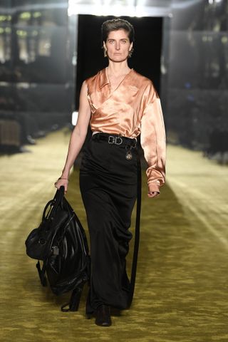 Martine Rose runway with woman in silk shirt and long skirt
