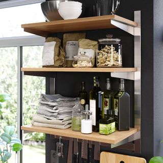 kitchen shelving with bowl and glass jar and bottels
