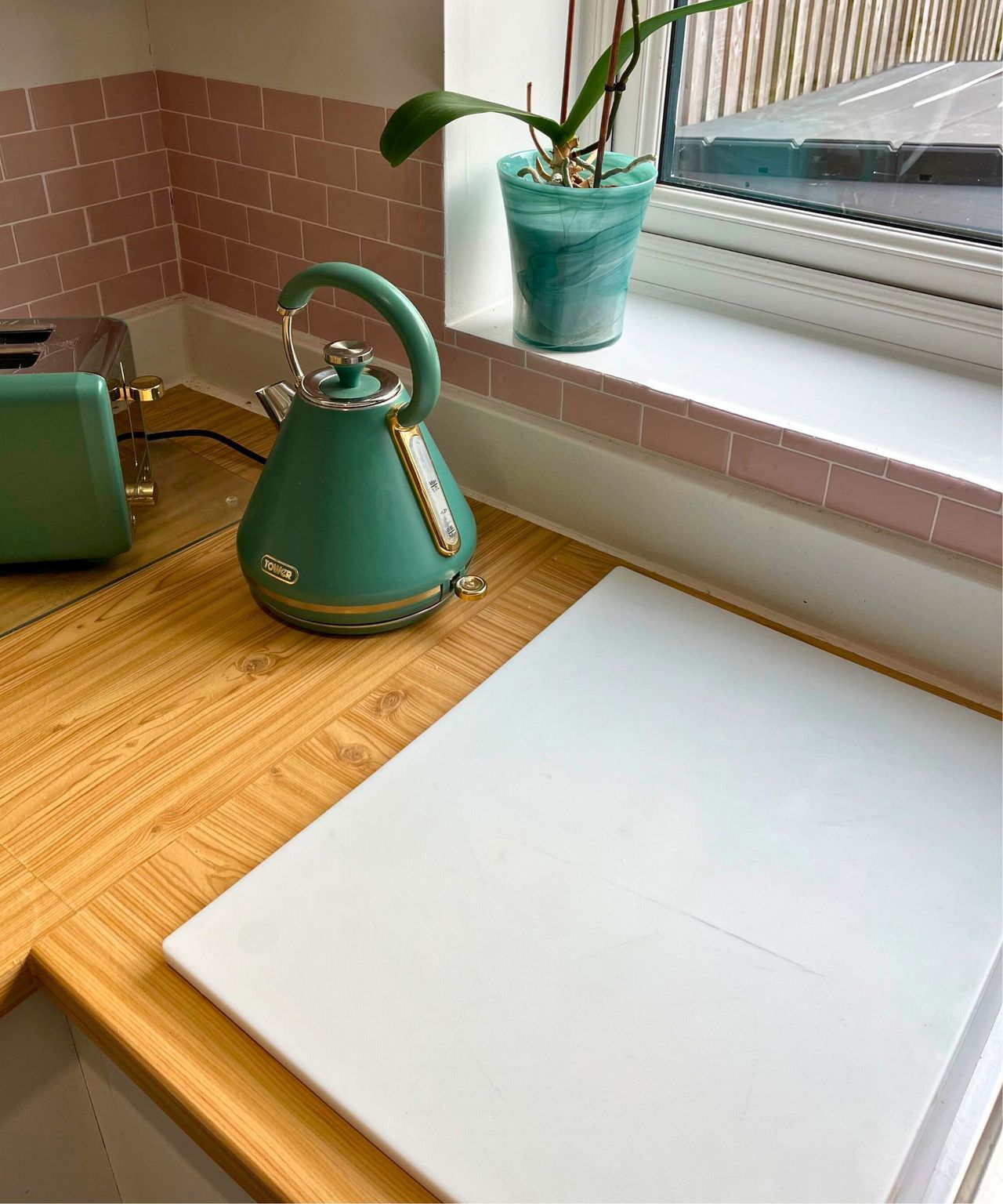 White plastic chopping board with scratches visible on surface