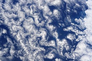 Veteran NASA astronaut Doug Hurley, who launched to the International Space Station aboard SpaceX's Crew Dragon craft as part of the company's Demo-2 mission on May 30, snapped this incredible photo from the space station. Hurley's view from space shows striking cloud formations over the South Pacific Ocean. "Cloud art in the South Pacific," Hurley wrote alongside the image which he shared on Twitter.