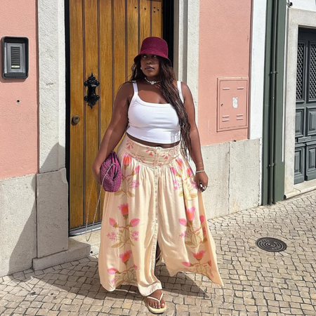 An image of a woman wearing summer scoop neck tank outfit 2026