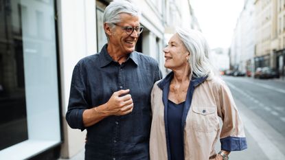 Senior couple walking around the city