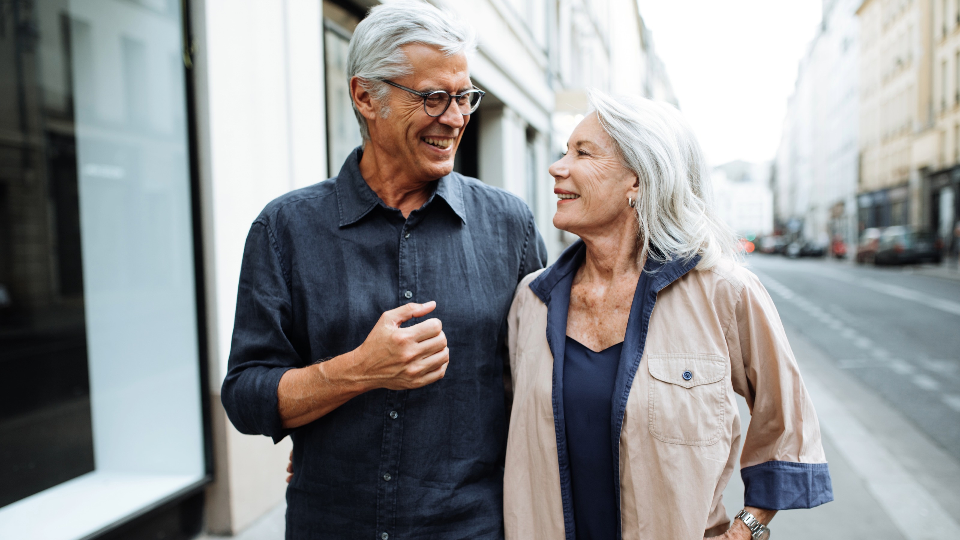 Senior couple walking around the city
