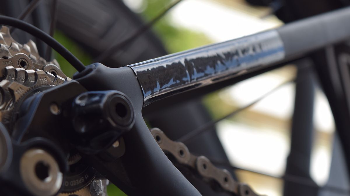 You can just about make out the Tarmac branding underneath the tape on the seat stays