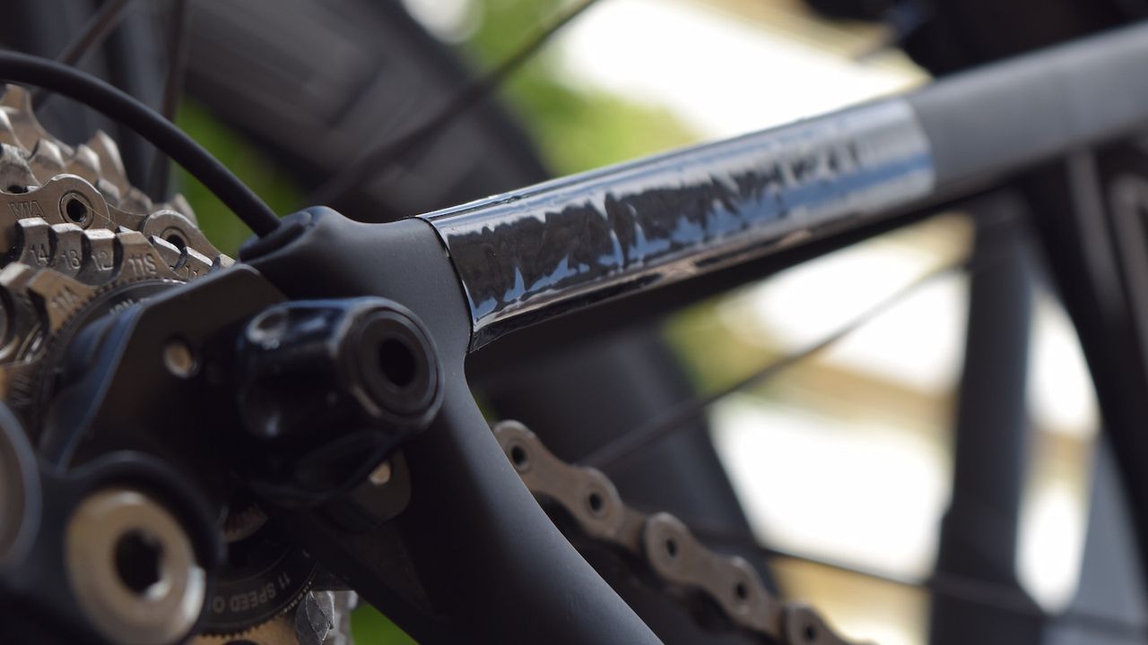 You can just about make out the Tarmac branding underneath the tape on the seat stays