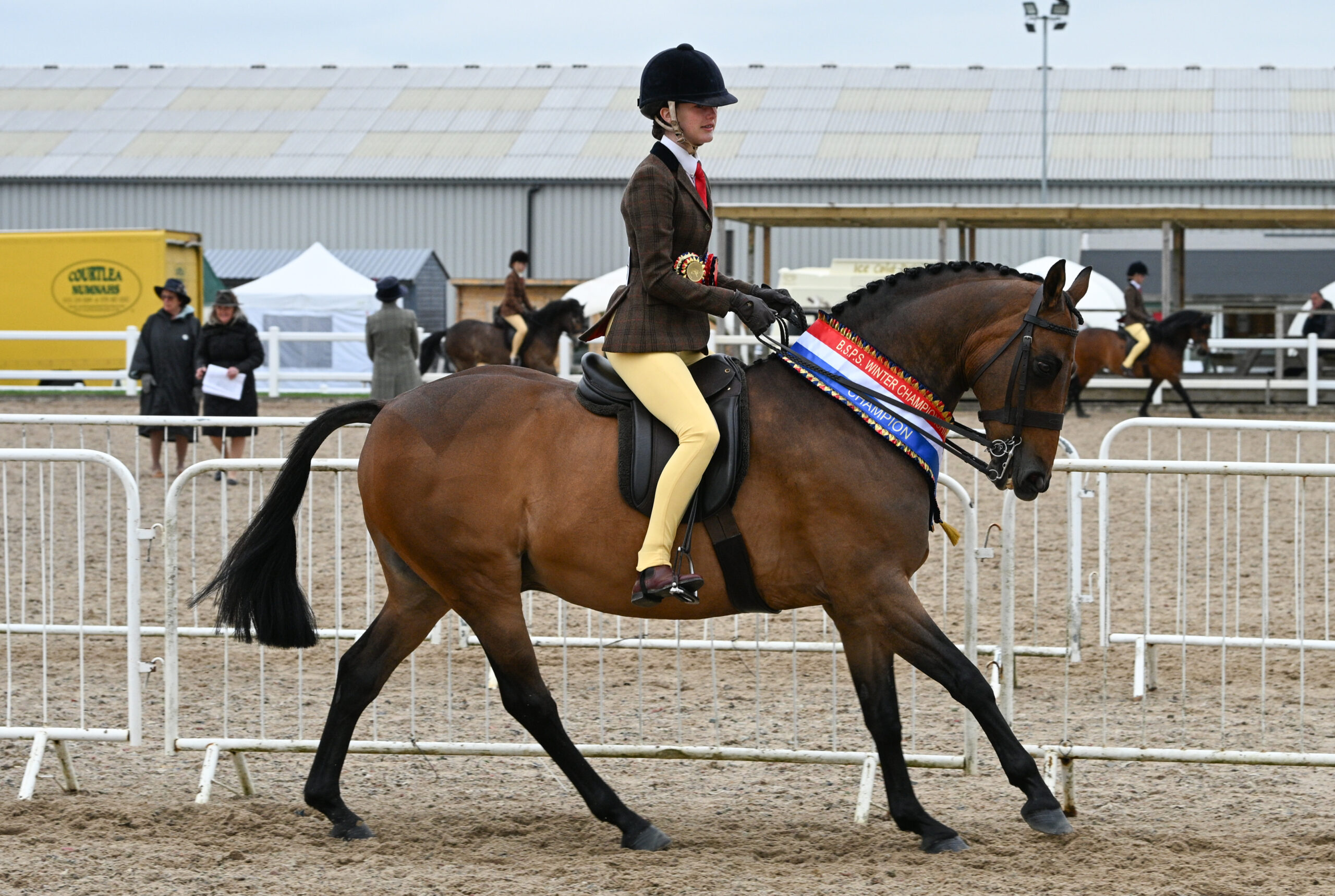 Sutton Grange Fancy That and Isla Smith canter on their lap of honour aftrer they take the RIHS Show Hunter Pony Championship
