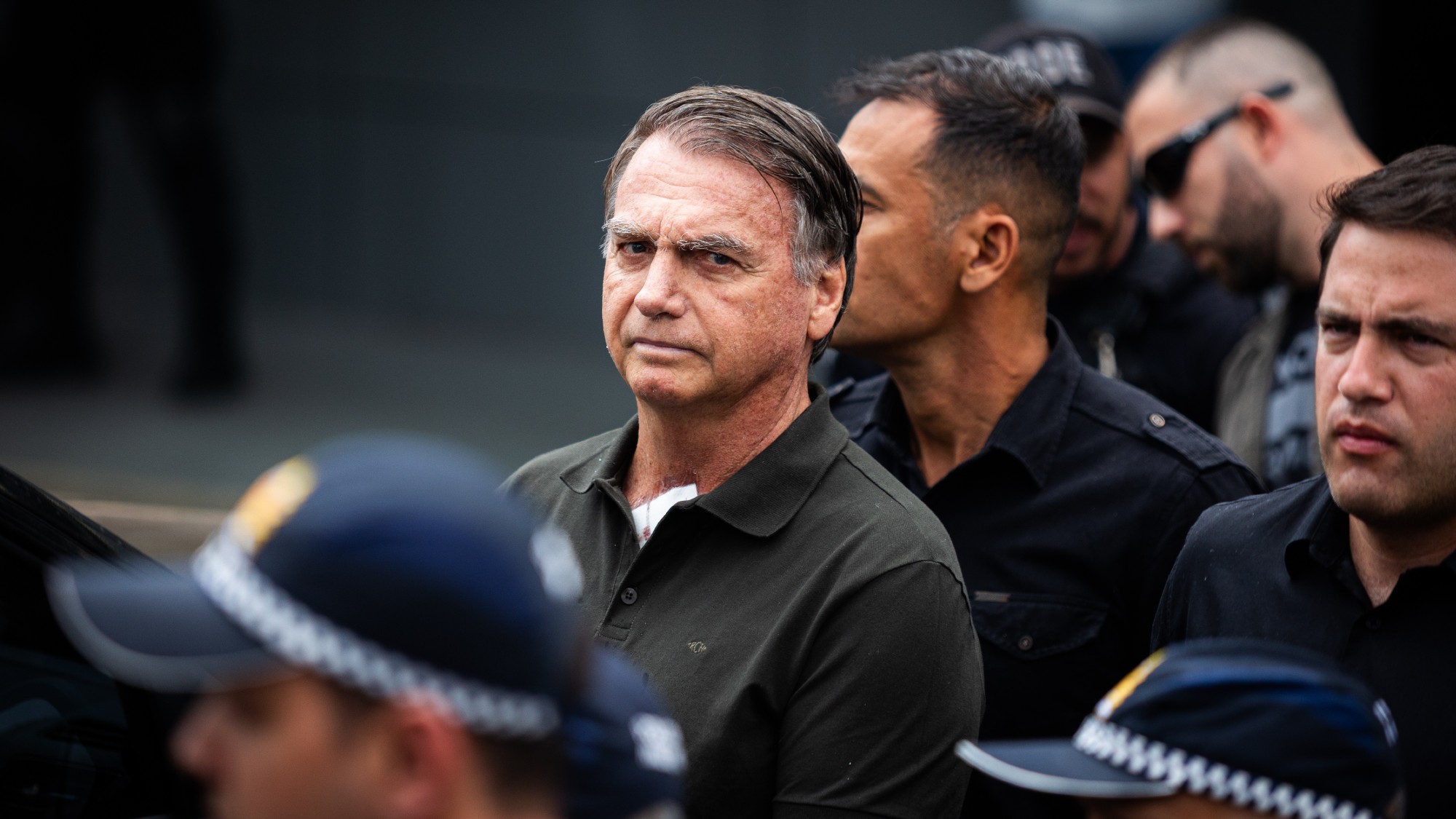 Jair Bolsonaro, Brazil's former president, flanked b police