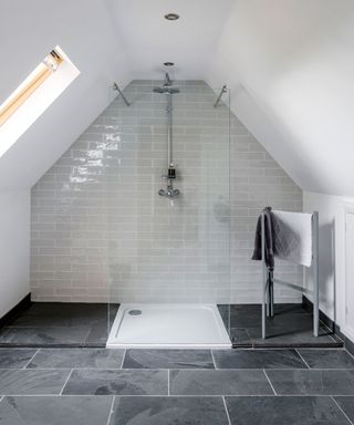 Walk-in bathroom shower ideas under the eaves with metro tiles.