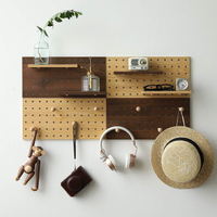 Wooden Pegboard Modular Display Organization Storage Wall Hooks | Was $36.99, now $33.90 at Amazon