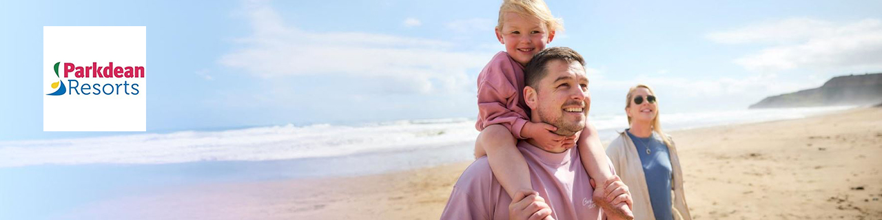 Park dean logo top left with a wide image of a family on the beach
