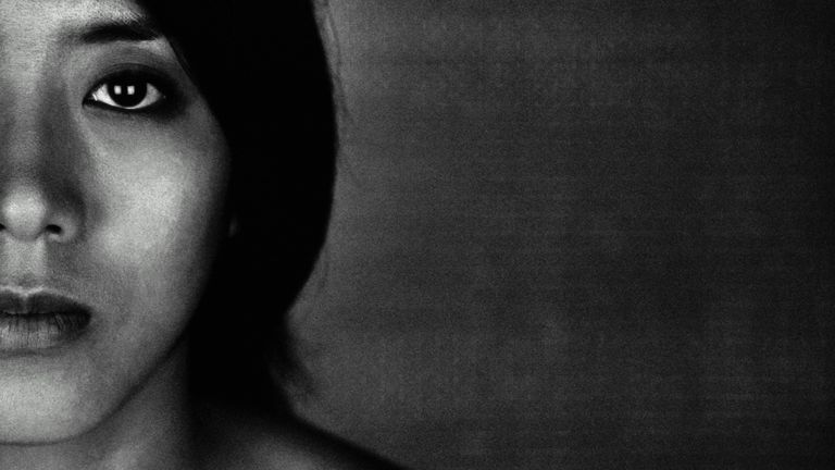 Black and white photograph of sad woman