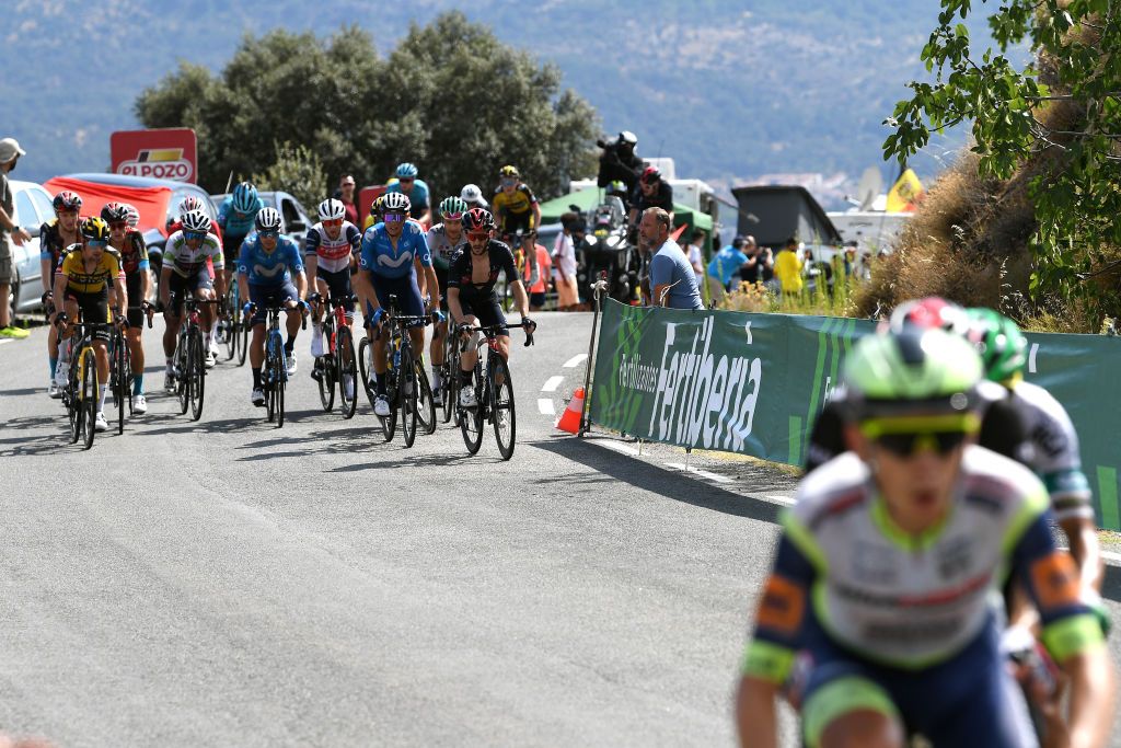 EL BARRACO SPAIN AUGUST 29 LR Primoz Roglic of Slovenia and Team Jumbo Visma Egan Arley Bernal Gomez of Colombia and Team INEOS Grenadiers white best young jersey Enric Mas Nicolau of Spain and Movistar Team Adam Yates of United Kingdom and Team INEOS Grenadiers compete in the chase group during the 76th Tour of Spain 2021 Stage 15 a 1975km km stage from Navalmoral de la Mata to El Barraco lavuelta LaVuelta21 on August 29 2021 in El Barraco Spain Photo by Tim de WaeleGetty Images