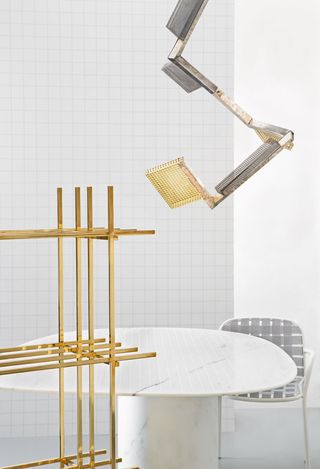 ‘Hash’ bookshelf ‘Solid Patterns’ table brass chandelier and ‘Yard’ armchair