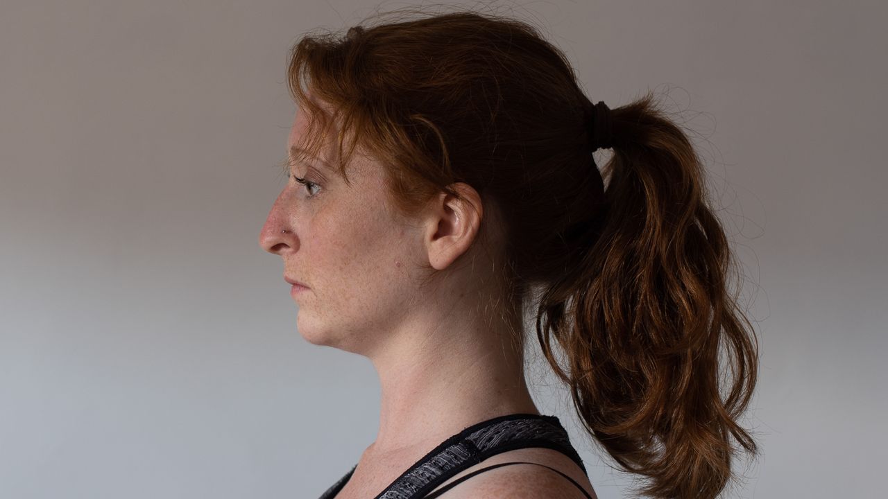 desk exercises: woman with head held straight and upright