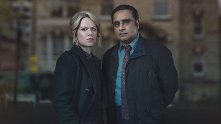 Detectives Jesse James (Sinéad Keenan) and Sunny Khan (Sanjeev Bhaskar) photographed against the backdrop of an out-of-focus London building in Unforgotten Season 6.