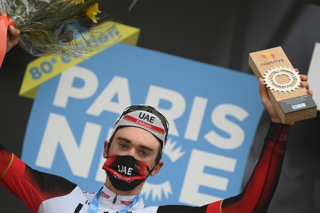 UAE Team Emirates US rider Brandon McNulty celebrates on the podium after winning the 5th stage of the 80th Paris Nice cycling race 189 km between SaintJustSaintRambert and SaintSauveurdeMontagut on March 10 2022 Photo by FRANCK FIFE AFP Photo by FRANCK FIFEAFP via Getty Images