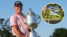Justin Thomas holds a trophy and an inset of his home
