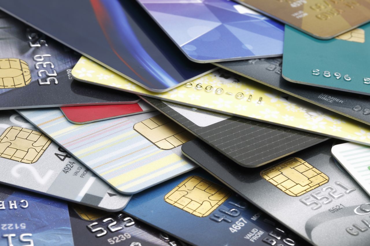 Colorful stack of credit cards and shopping gift cards. Macro with extremely shallow dof.