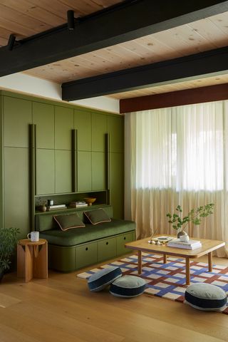 a play room with a green built-in