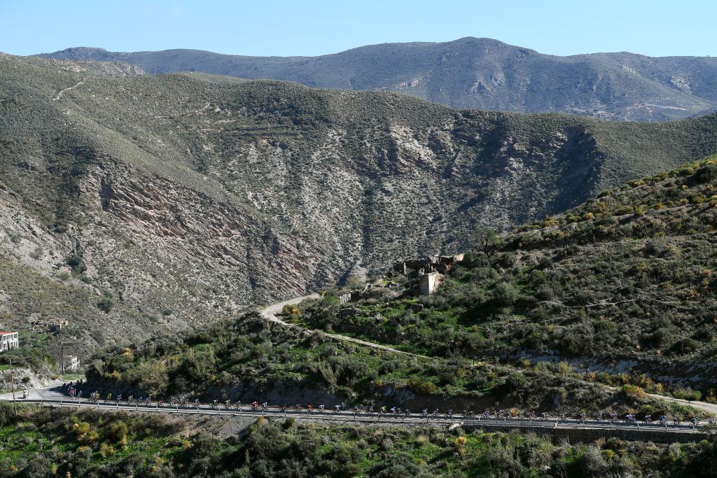 ROQUETAS DE MAR SPAIN FEBRUARY 14 The Peloton during the 34th Clsica de Almeria 2021 a 1833km race from Pueblo de Vicar to Roquetas de Mar Alto de Fuente Marbella 300m Landscape Mountains ClasicaAlmeria21 on February 14 2021 in Roquetas de Mar Spain Photo by Tim de WaeleGetty Images