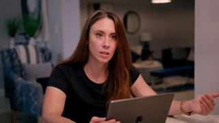 Casey Anthony in front of a laptop in Casey Anthony: Where the Truth Lies