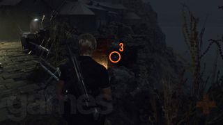 Resident Evil 4 Remake Cliffside Ruins Blue Medallion hanging over lower ruins tunnel