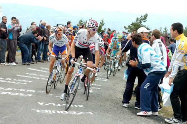 Bradley Wiggins (Sky) knows that Jakob Fuglsang has been distanced as he drives for the summit.