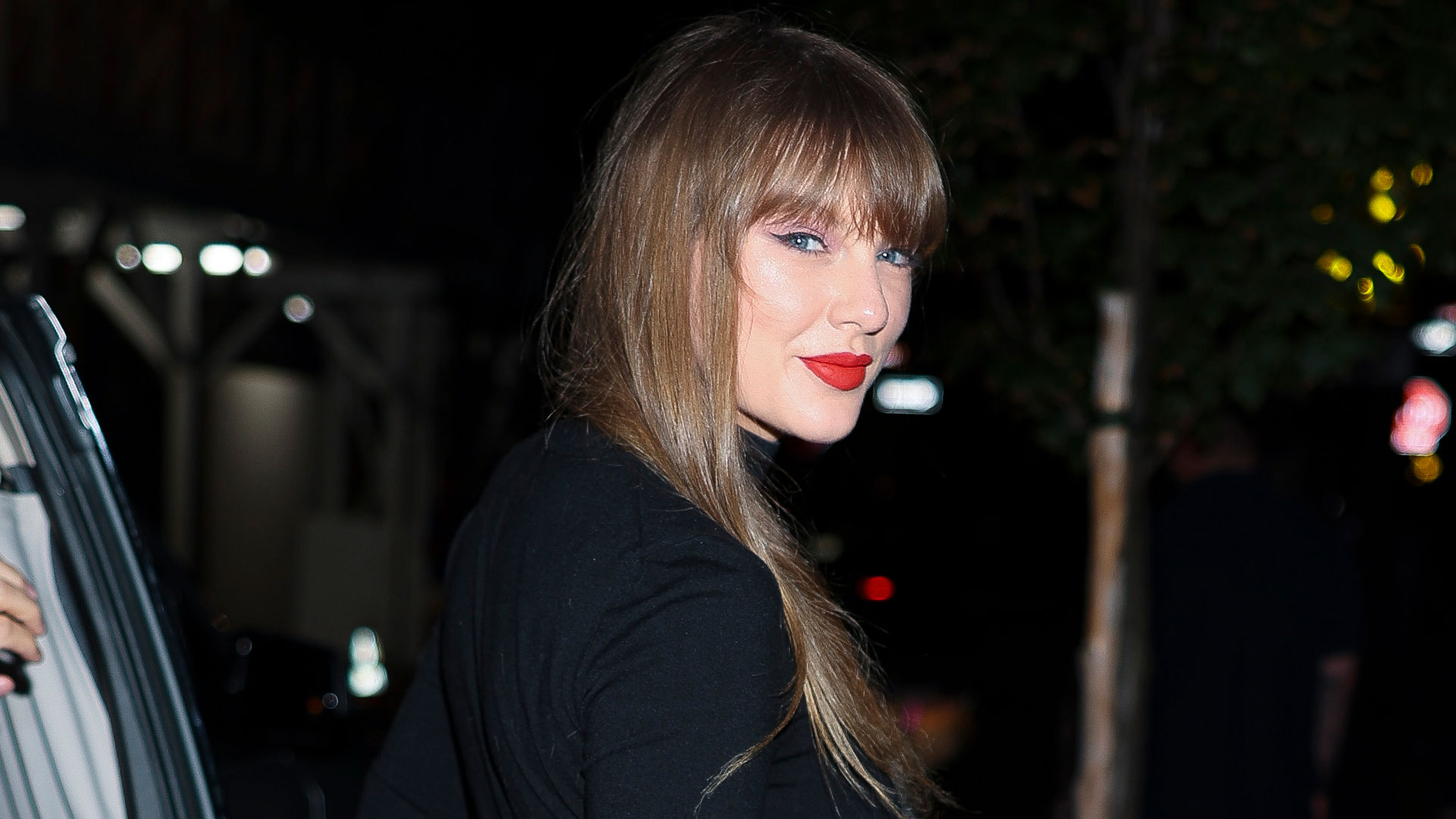 Taylor Swift wears a plaid miniskirt