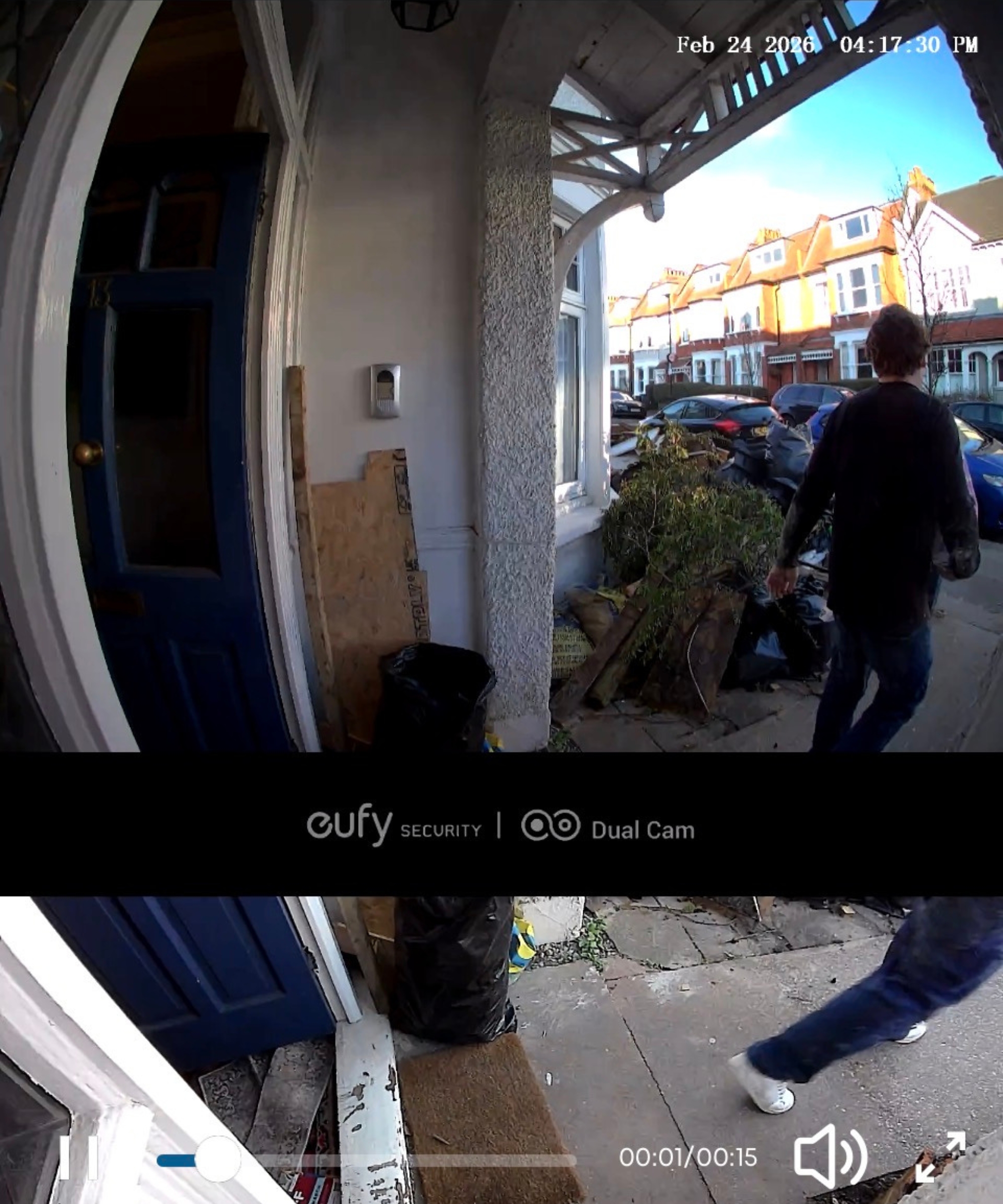 Screenshot of eufy app showing fish-eye lens footage from eufy S330 video doorbell, of porch with person walking away from an open front door.