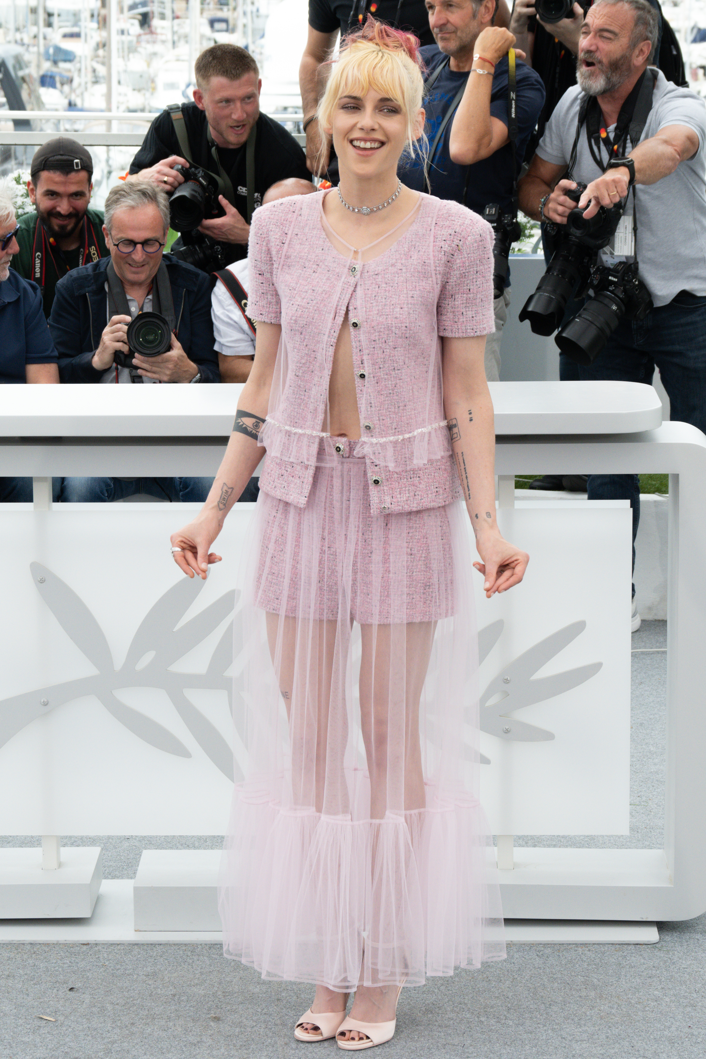 Kristen Stewart wearing a sheer pink skirt during "The Chronology of Water" photocall at the 78th annual Cannes Film Festival at Palais des Festivals