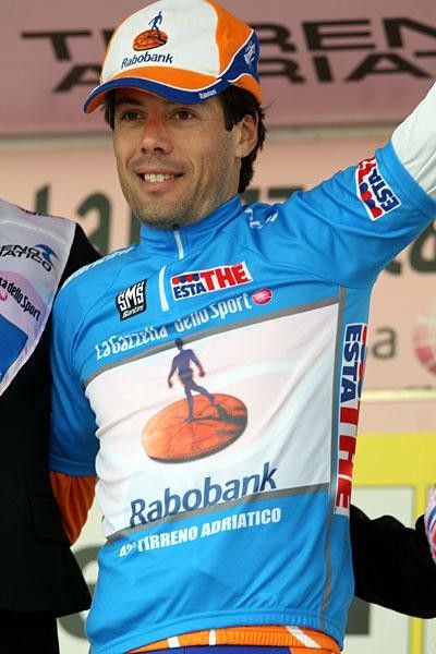 A blue Freire is happy but his cap looks a little too large.