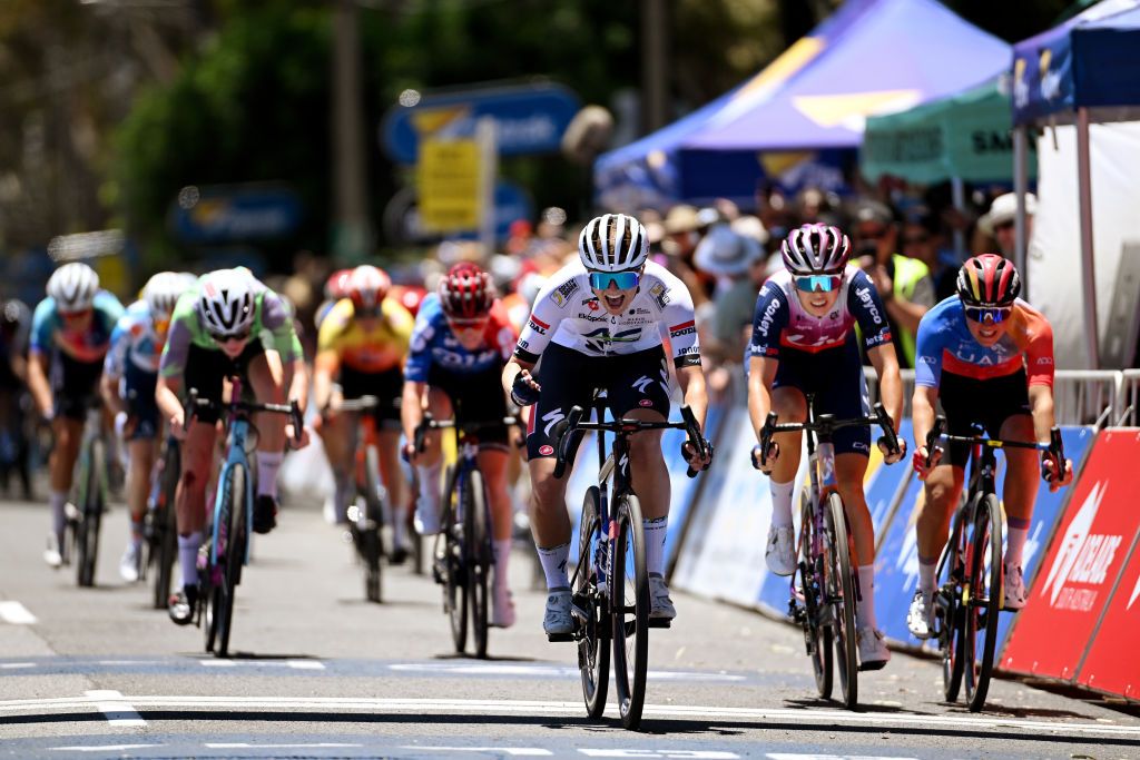 Ally Wollaston (AG Insurance Soudal) celebrates at finish line as stage winner ahead of Georgia Baker (LIV Alula Jayco) and Sofia Bertizzolo (UAE Team ADQ)