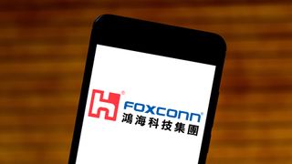 The Hon Hai/Foxconn logo displayed on a smartphone