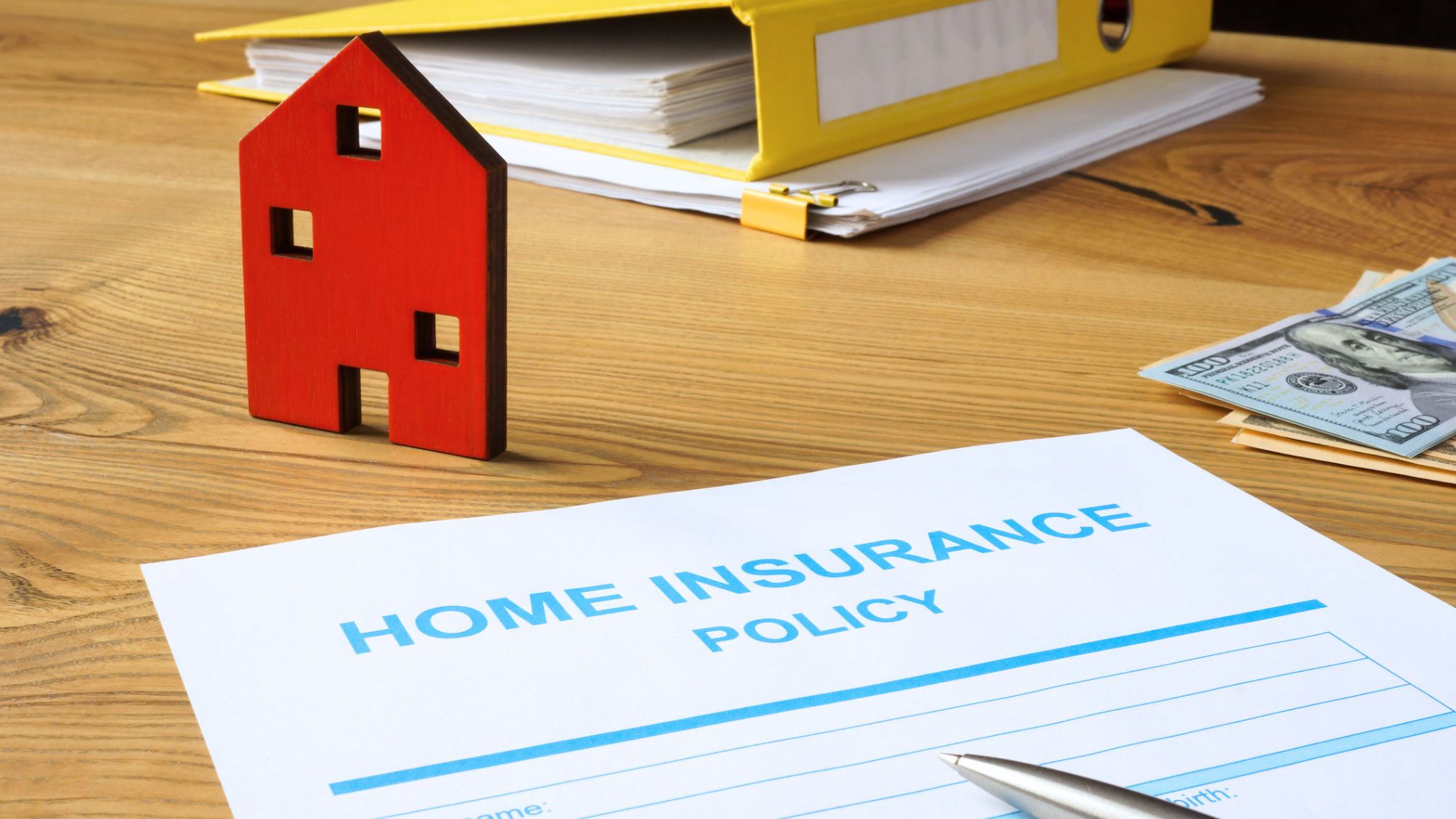 Home insurance policy document lying on a desk. 