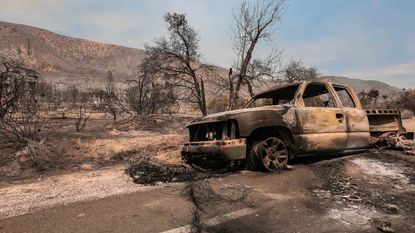 picture of a pickup truck burned by a wildfire