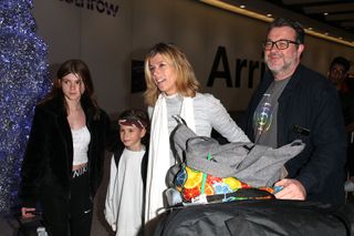 Kate Garraway with her husband Derek Draper, and children Darcey Draper and William Draper arrive at Heathrow Airport