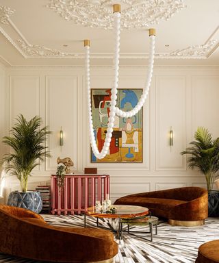 Large living room with statement ceiling light from Cameron Design House